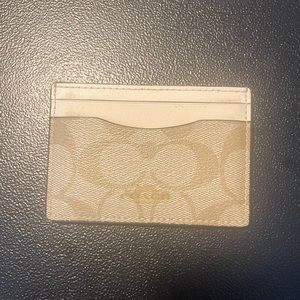 Coach 4 pocket men’s wallet. Signature C’s / cream
